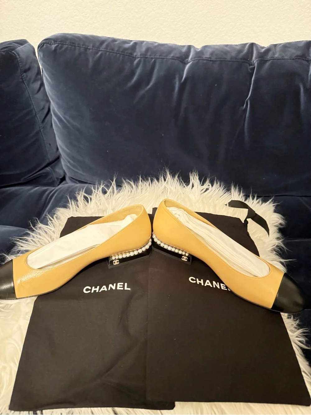 CHANEL Tan Leather Ballet Flats with Black Cap Toe and Pearl Heel Trim